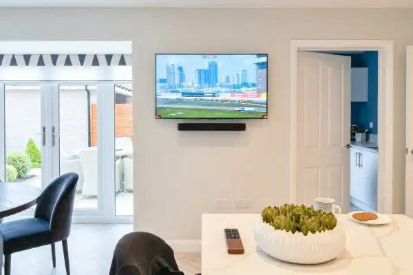 TV and soundbar wall mounted in open-plan living area, Halstead